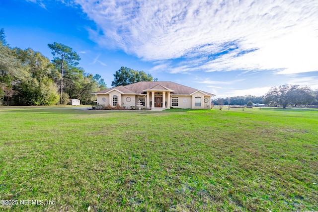 ranch-style house featuring a front lawn