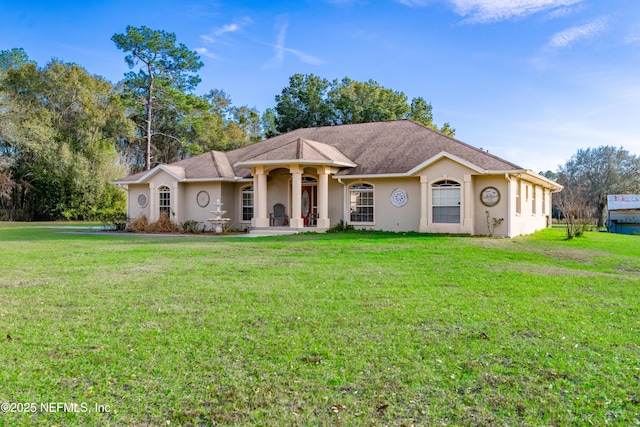 ranch-style house featuring a front lawn