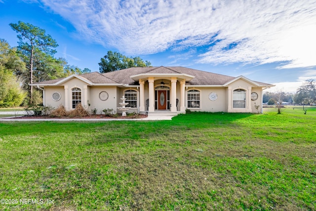 ranch-style home featuring a front yard