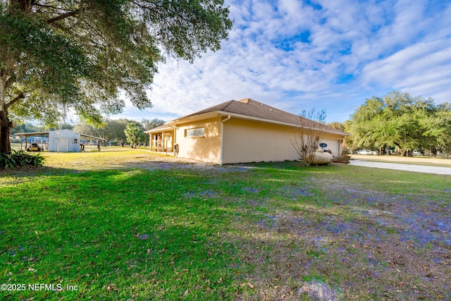 view of home's exterior with a lawn