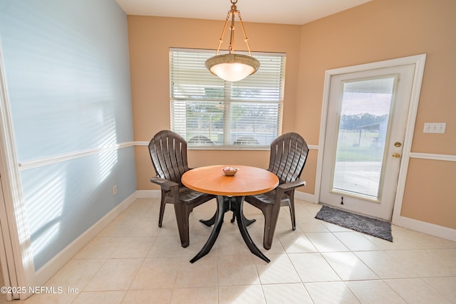 dining room with plenty of natural light and light tile patterned floors