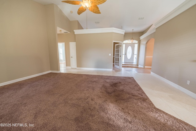 interior space with light tile patterned floors and ceiling fan