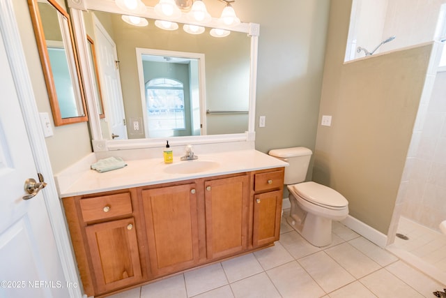 bathroom with tile patterned floors, vanity, toilet, and walk in shower