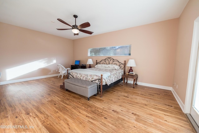 bedroom with ceiling fan and light hardwood / wood-style floors