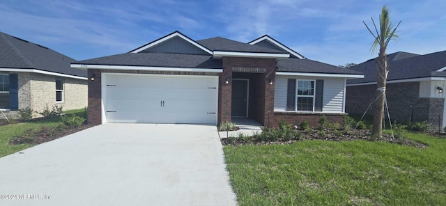 view of front of house with a front lawn and a garage