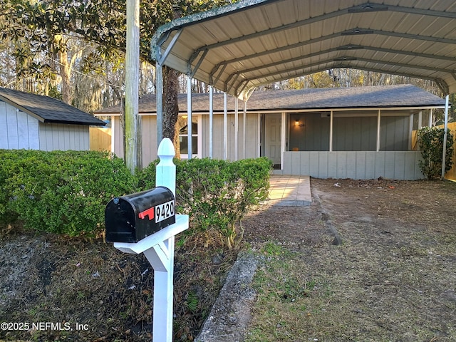 exterior space with a carport