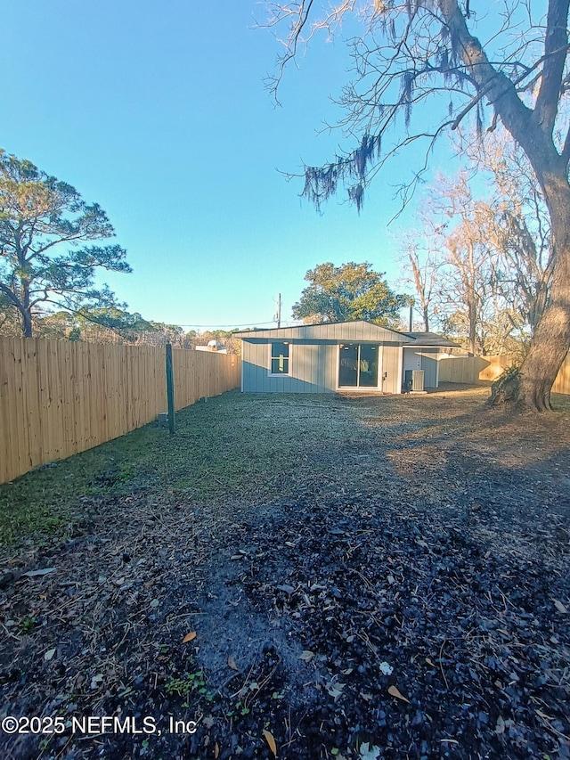 exterior space with a fenced backyard