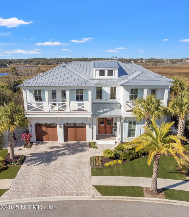 view of front of house with a balcony and a garage