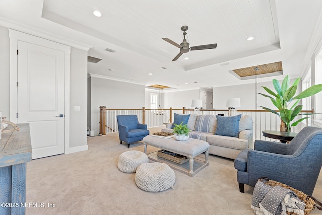 living room featuring light carpet, plenty of natural light, wooden ceiling, and a tray ceiling