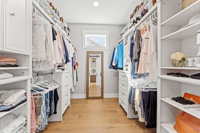 walk in closet featuring light hardwood / wood-style floors