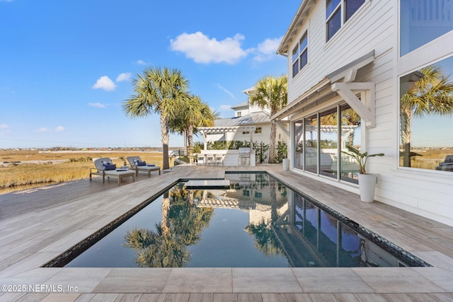 view of swimming pool featuring a patio area and a pergola