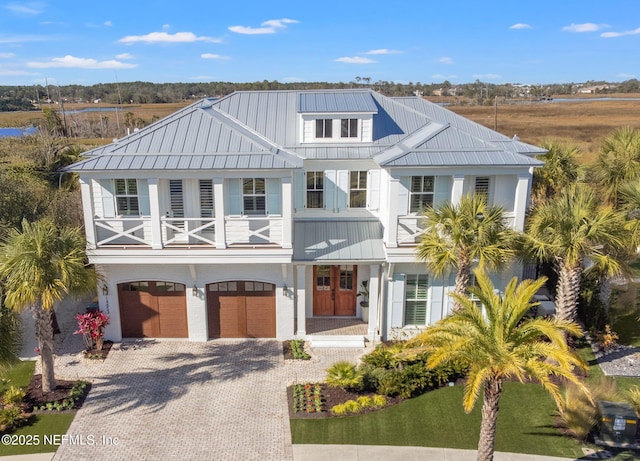 view of front of property with a balcony and a garage