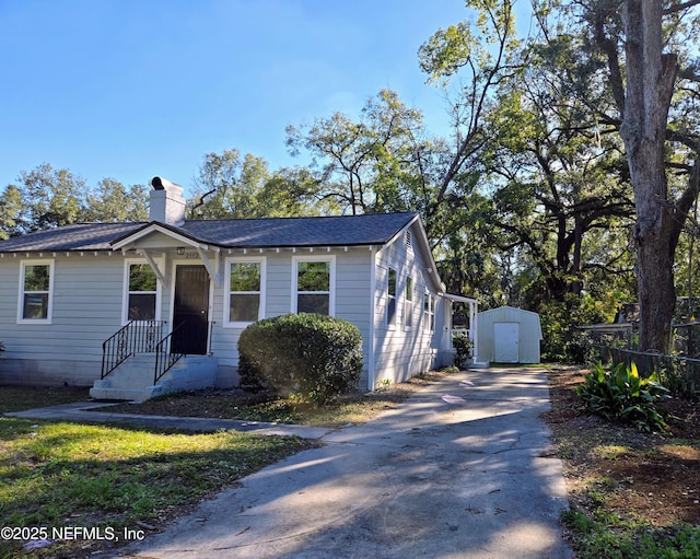 view of front facade featuring a storage shed