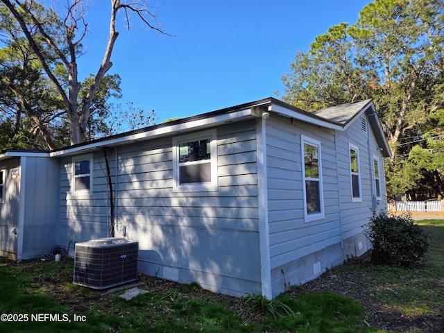 view of side of home with cooling unit