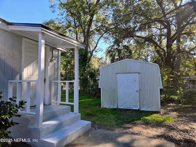 view of outbuilding featuring a lawn