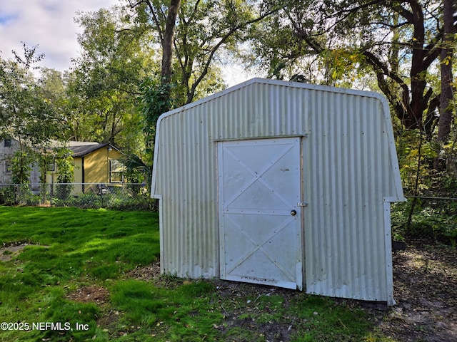 view of outdoor structure featuring a yard