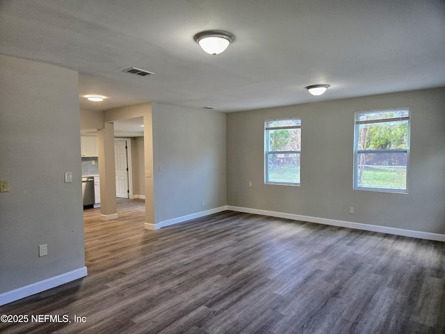 unfurnished room featuring dark hardwood / wood-style floors