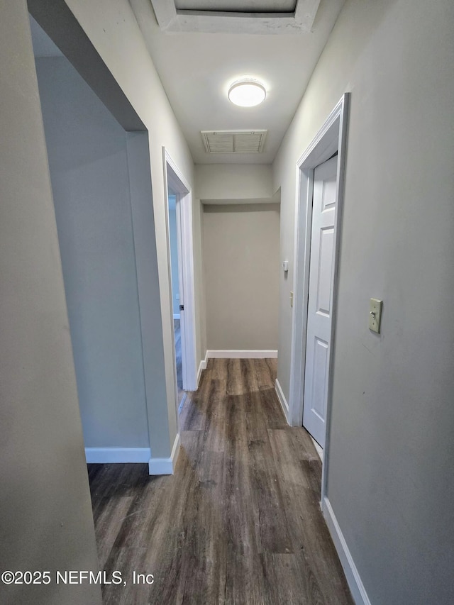 hallway featuring dark hardwood / wood-style floors