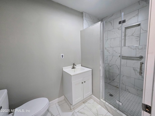 bathroom with toilet, an enclosed shower, and vanity