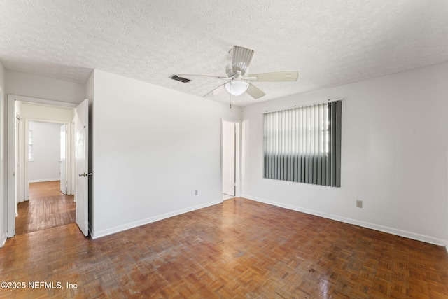 unfurnished room featuring a textured ceiling and ceiling fan