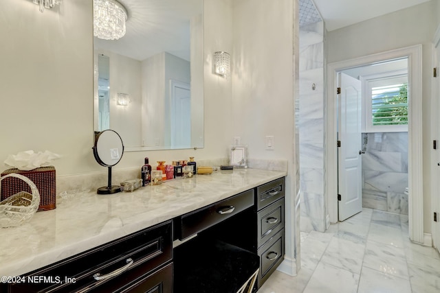 bathroom with marble finish floor and vanity