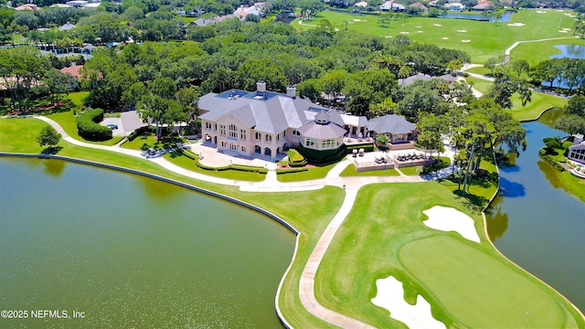 bird's eye view with a water view and golf course view