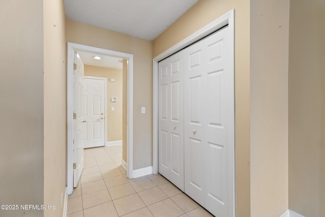 hallway with light tile patterned floors