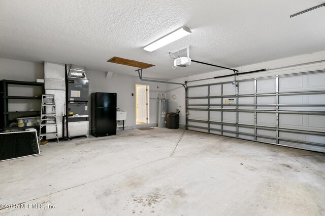 garage featuring sink, a garage door opener, and water heater