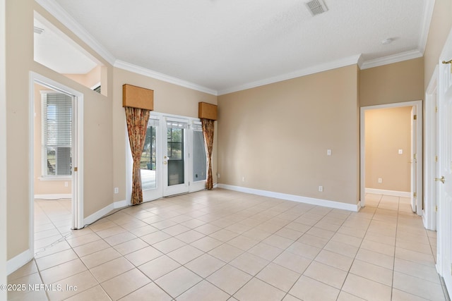 unfurnished room with ornamental molding and light tile patterned flooring