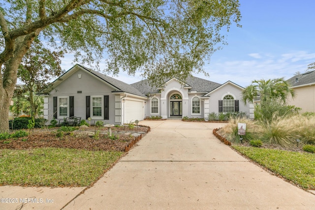 ranch-style home featuring a garage