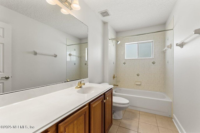bathroom featuring vanity, visible vents, a textured ceiling, tile patterned floors, and toilet