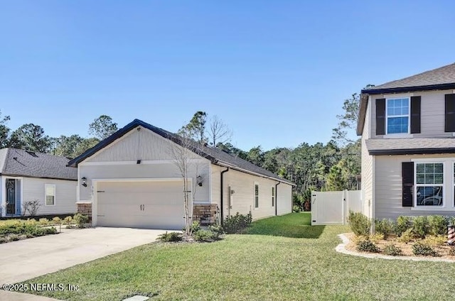 view of side of property featuring a garage and a lawn