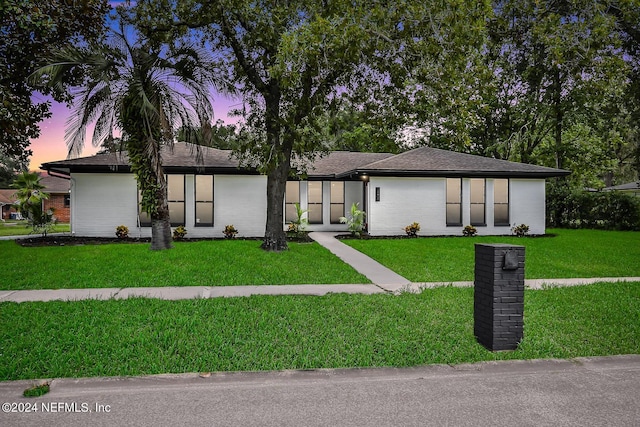 view of front of home featuring a yard