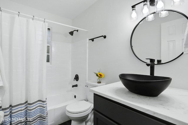 full bathroom featuring vanity, toilet, and shower / bathtub combination with curtain