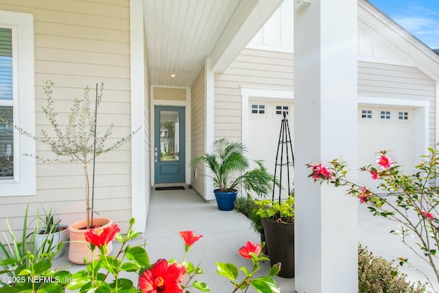 view of exterior entry featuring a garage