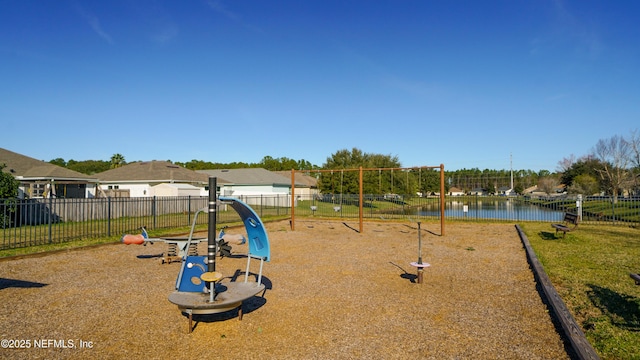 view of playground with a water view