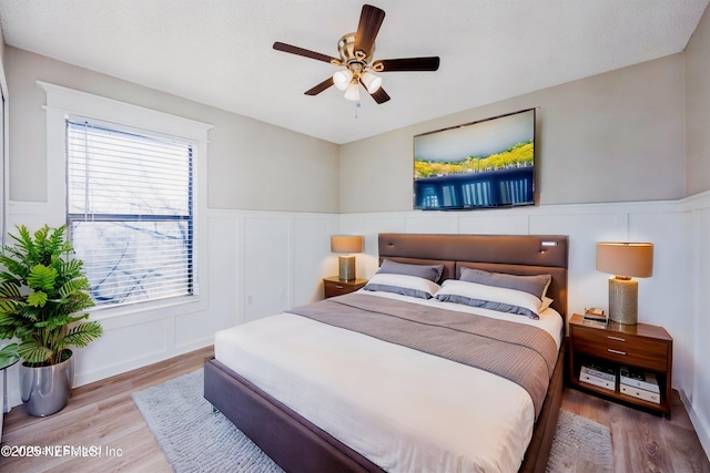 bedroom featuring hardwood / wood-style flooring and ceiling fan