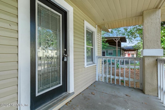 doorway to property with a porch