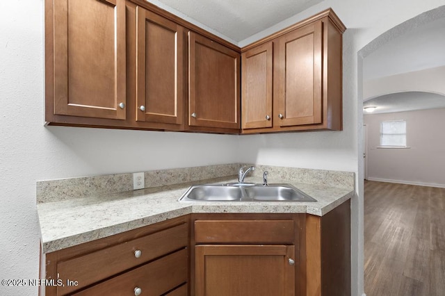 kitchen featuring hardwood / wood-style floors and sink