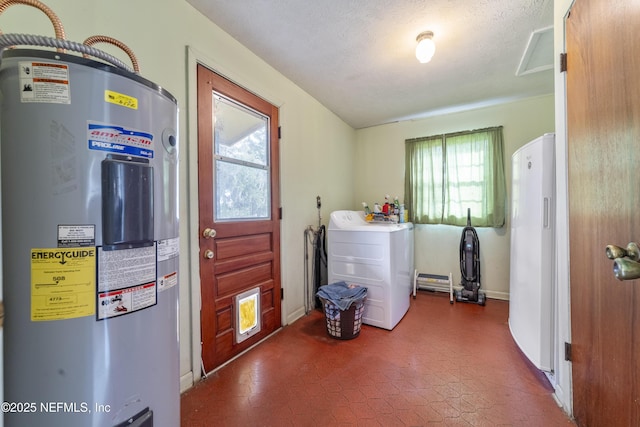 clothes washing area featuring washer / clothes dryer, electric water heater, and a textured ceiling