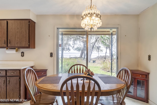 dining area with an inviting chandelier