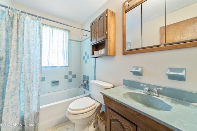 full bathroom with vanity, toilet, and shower / bath combo with shower curtain