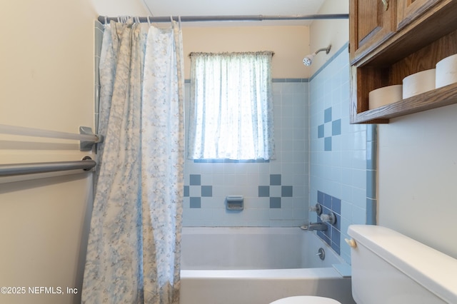 bathroom with shower / bathtub combination with curtain and toilet