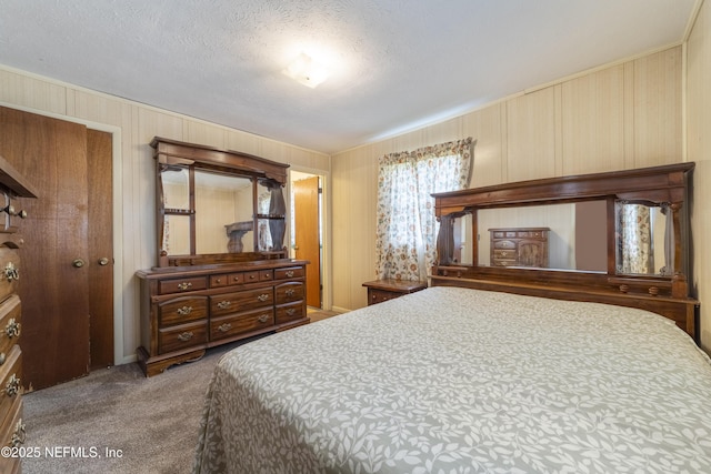 carpeted bedroom featuring a textured ceiling