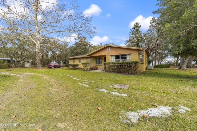 exterior space featuring a front lawn