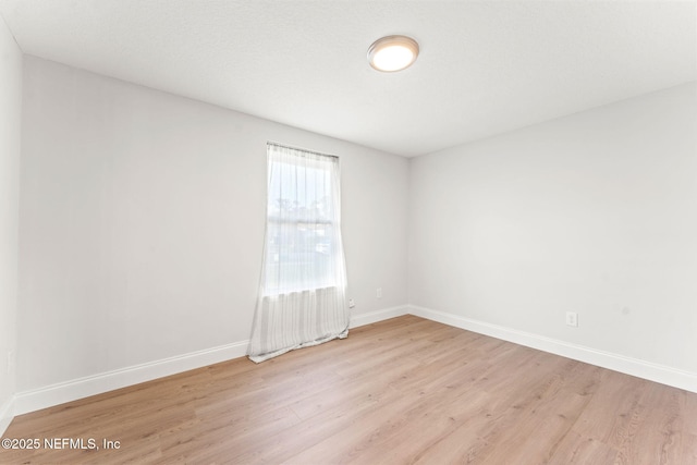 empty room with light wood-type flooring