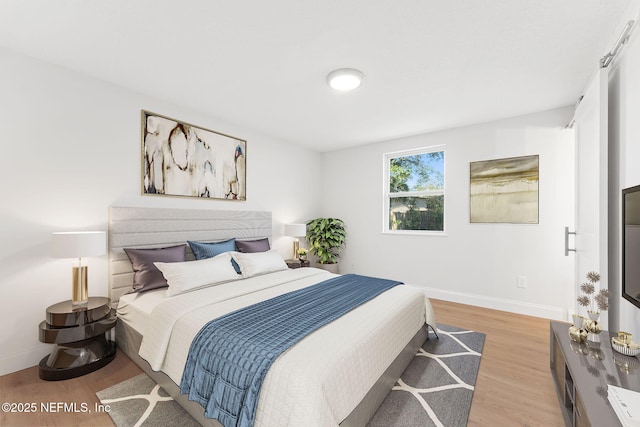 bedroom featuring light hardwood / wood-style floors