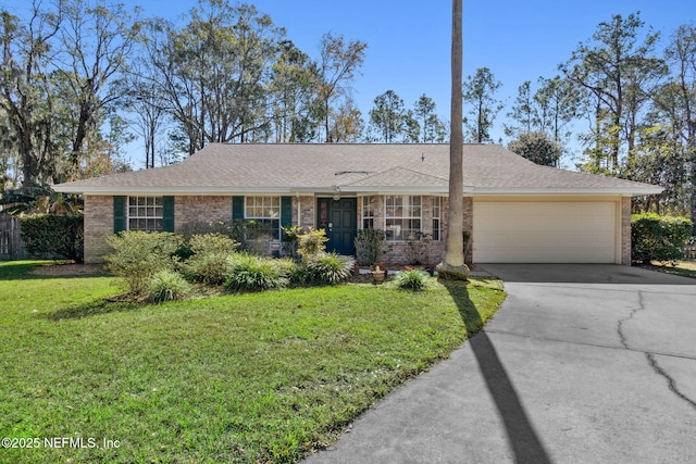 ranch-style home featuring a front yard and a garage