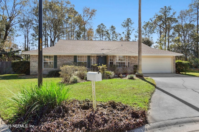 ranch-style home with a garage and a front lawn