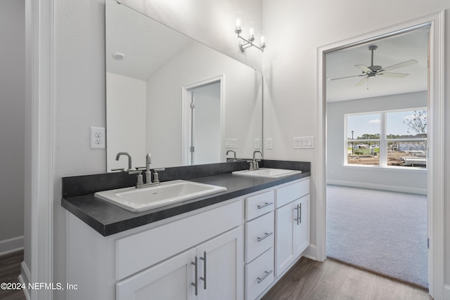 bathroom with vanity, hardwood / wood-style flooring, and ceiling fan